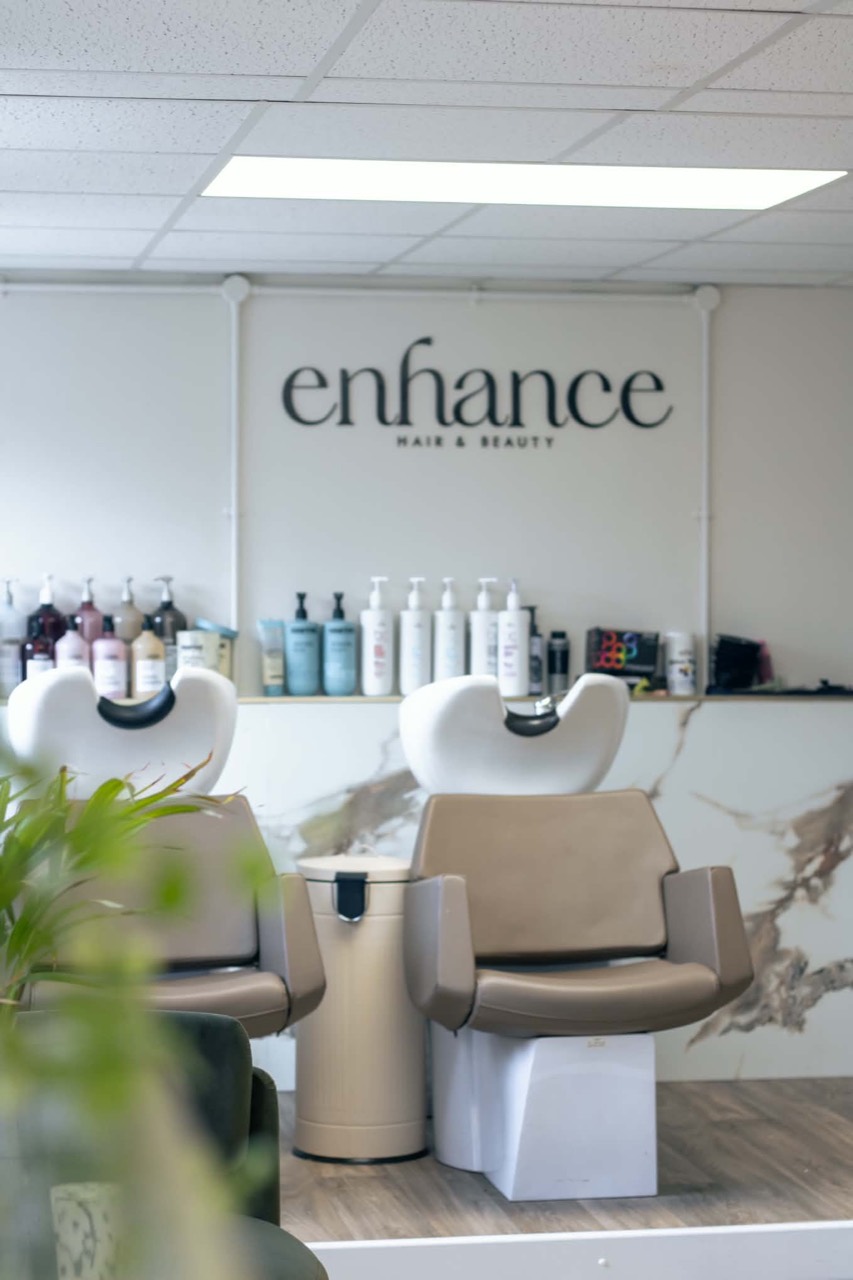 Enhance signage above the salon wash basins