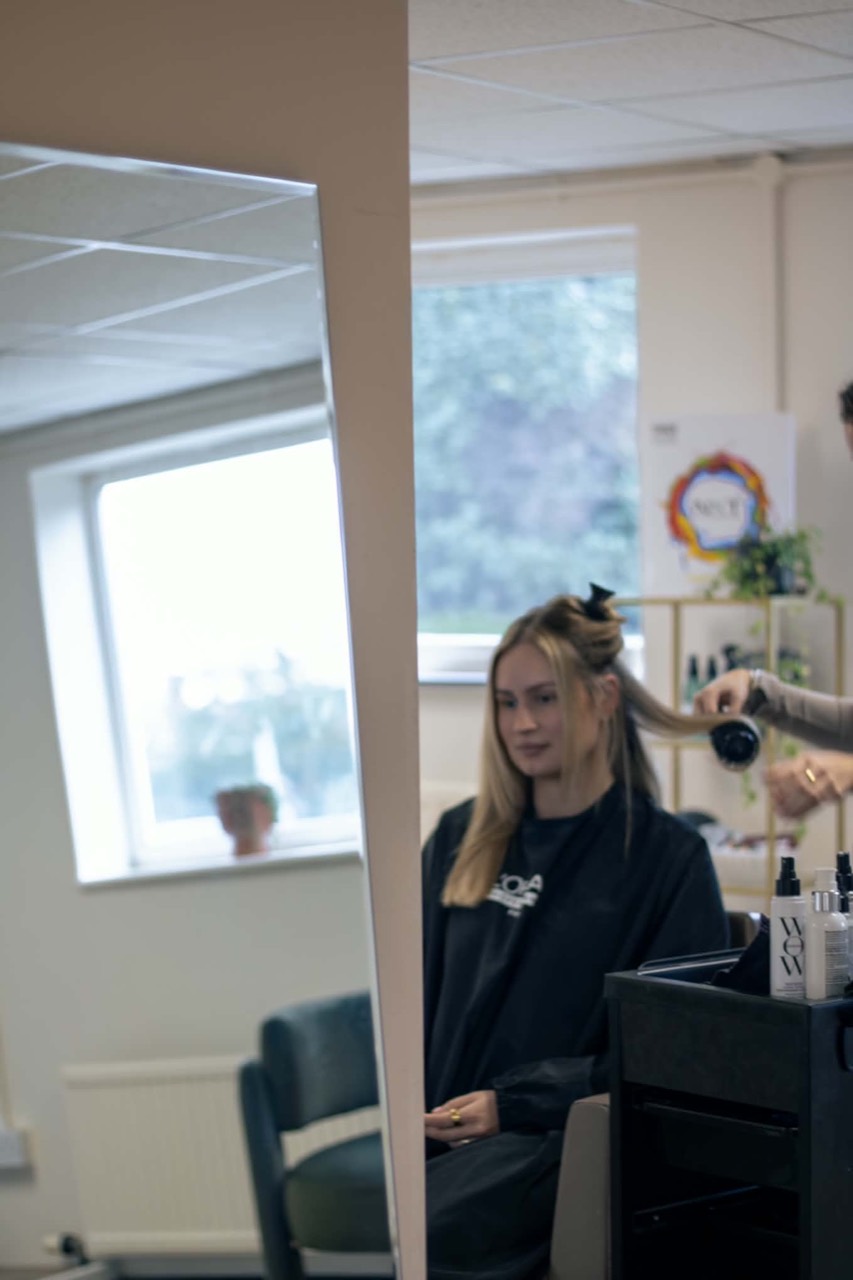 Hair styling reflected in a salon mirror