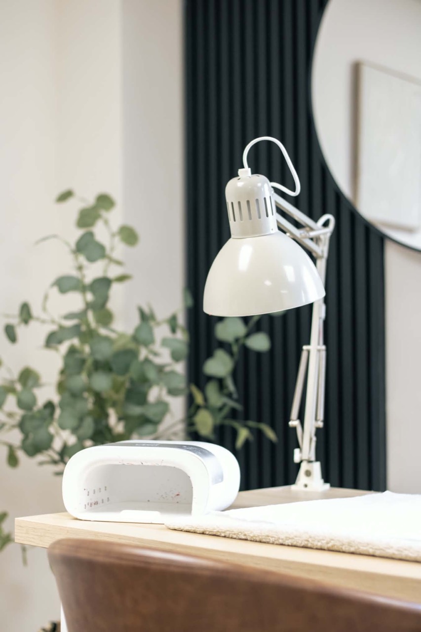 A manicure desk with nail lamp and task light
